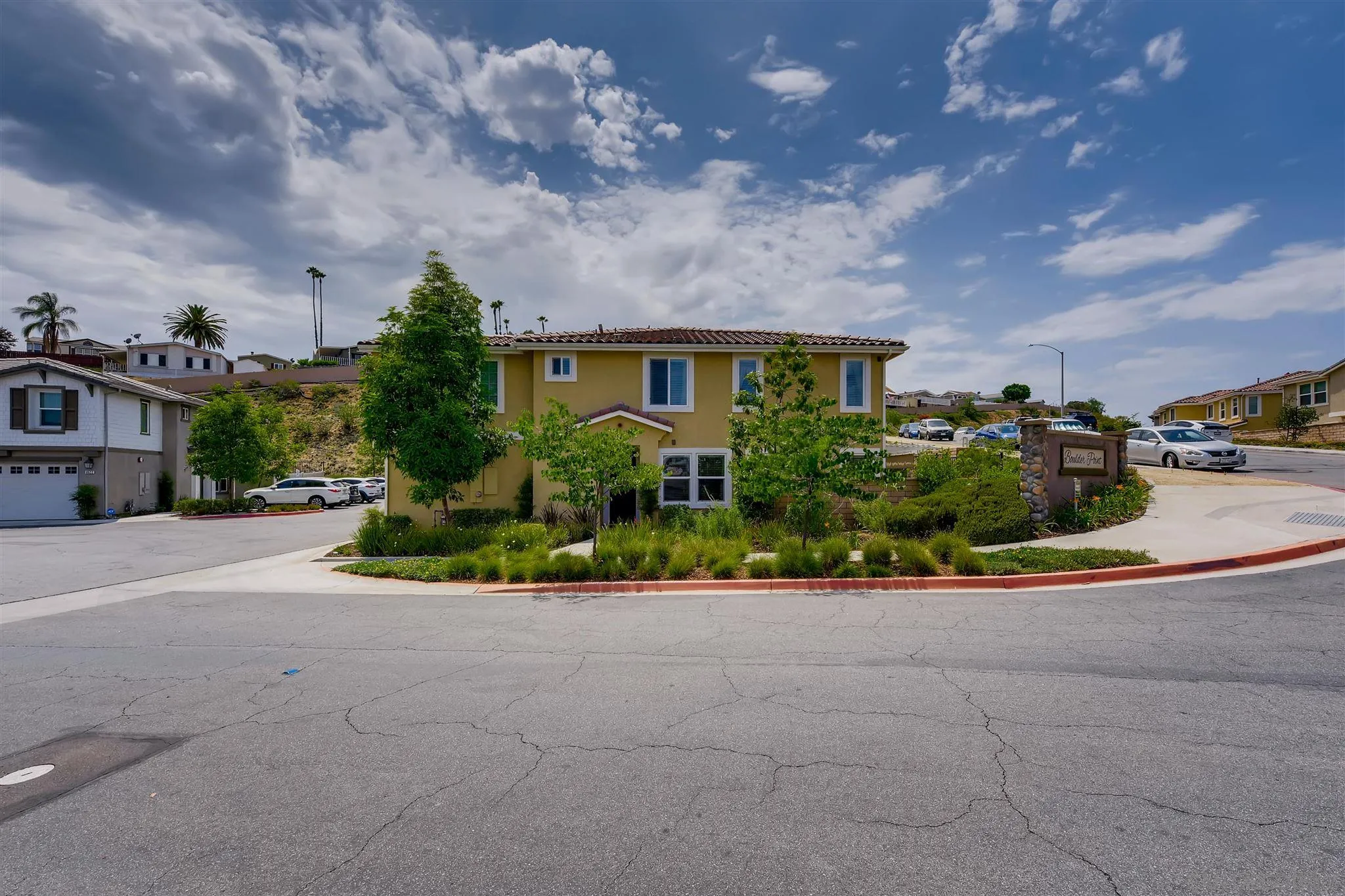 8629 Orchard Bloom Way El Cajon, CA 92021 - Photo 19 of 19 a view of a house with a yard and potted plants