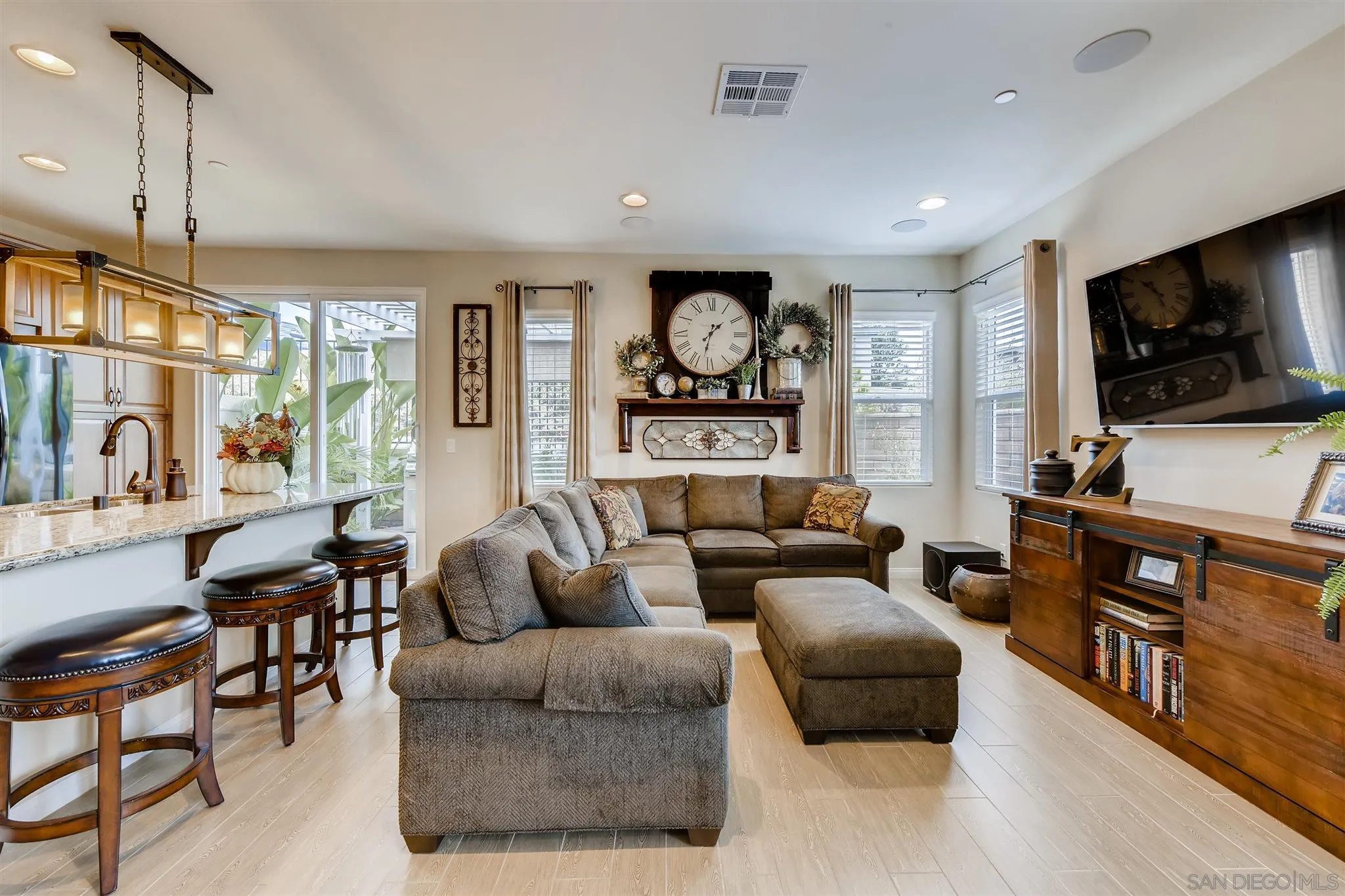 8629 Orchard Bloom Way El Cajon, CA 92021 - Photo 2 of 19 a living room with furniture and a flat screen tv