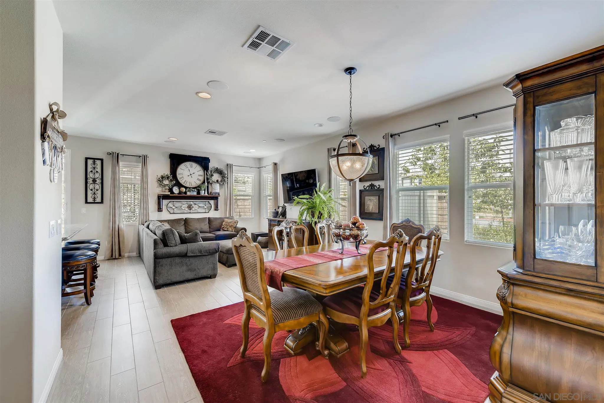 8629 Orchard Bloom Way El Cajon, CA 92021 - Photo 3 of 19 a view of a dining room with furniture window and wooden floor