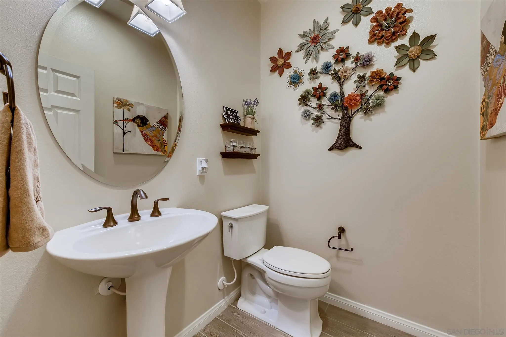 8629 Orchard Bloom Way El Cajon, CA 92021 - Photo 7 of 19 a bathroom with a toilet sink and mirror