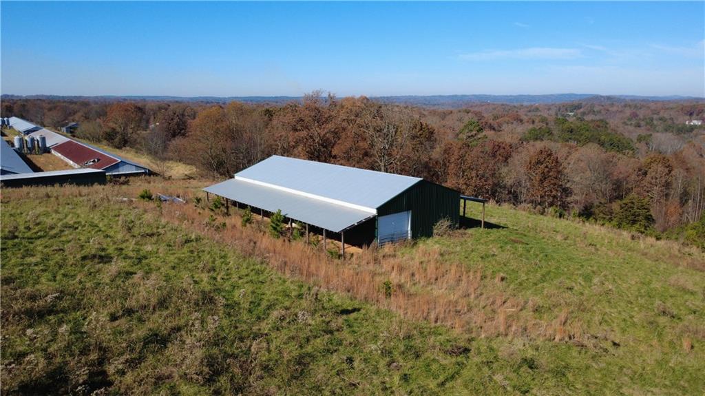 1350 Stivers Road Jasper, GA 30143 - Photo 30 of 69 an aerial view of a house with a yard and mountain in the back