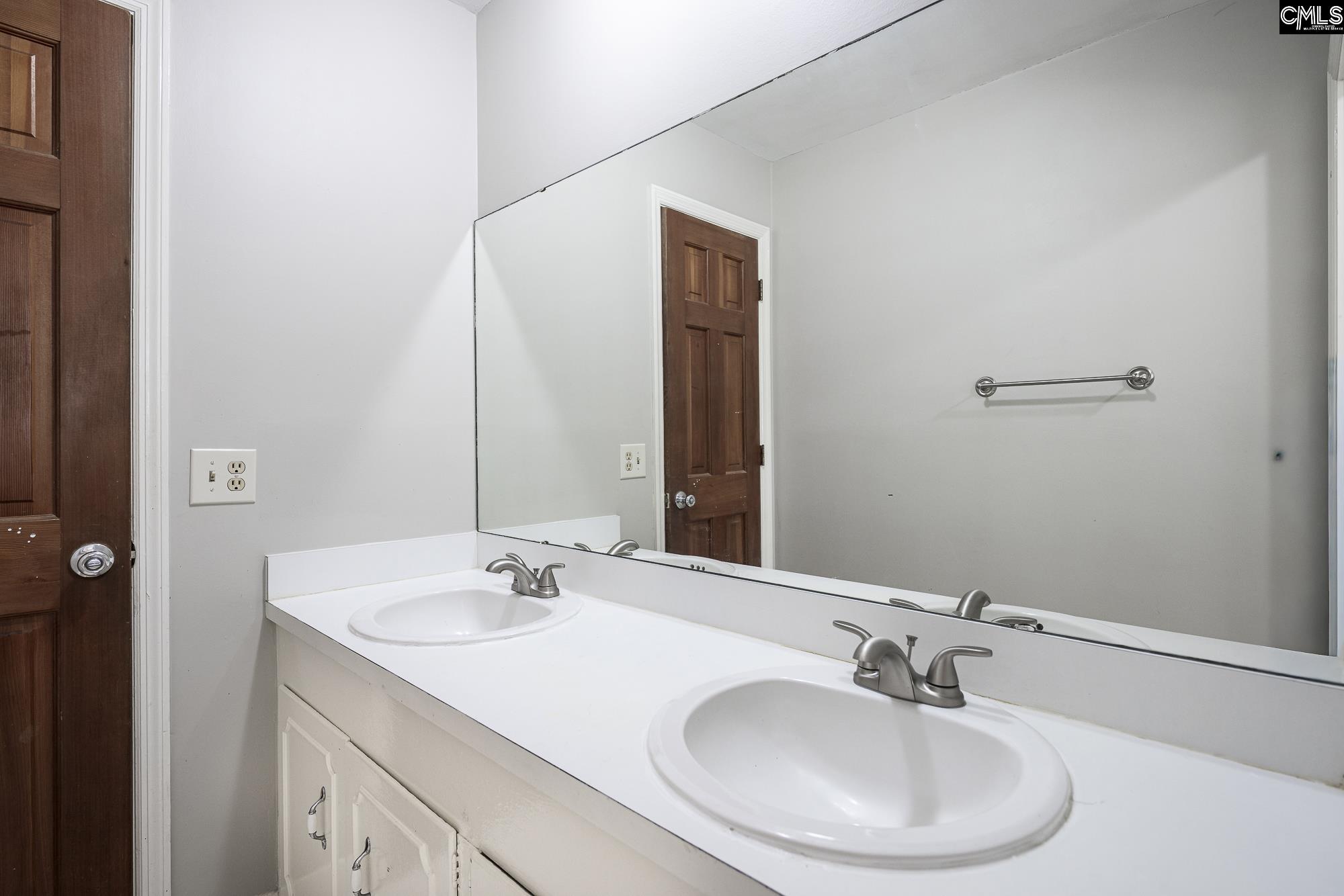 4083 Platt Springs Road West Columbia, SC 29170 - Photo 26 of 35 a bathroom with a sink and a mirror