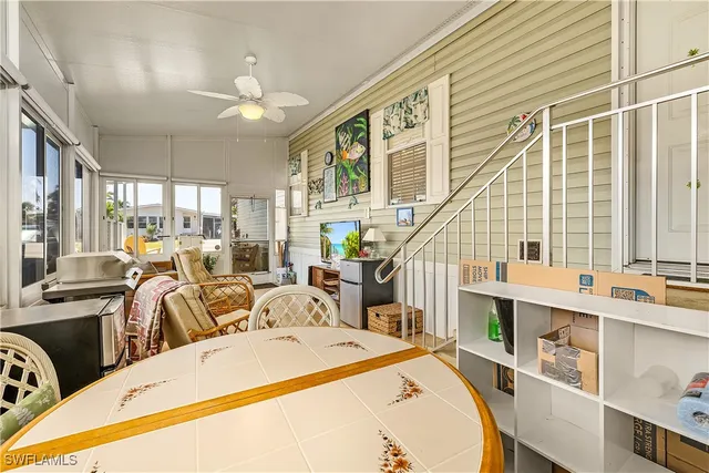 a very nice looking dining room with a large window