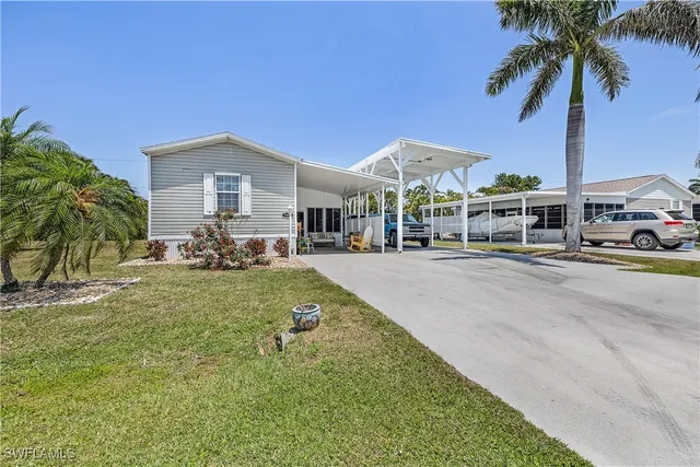 a view of a house with outdoor space and sitting area