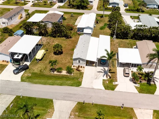 an aerial view of a house with outdoor space