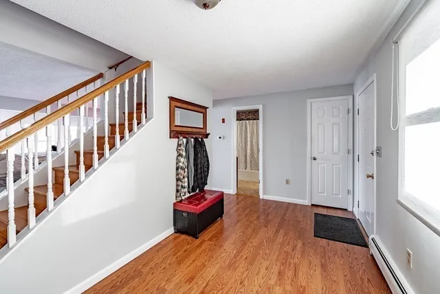 a view of entryway with wooden floor