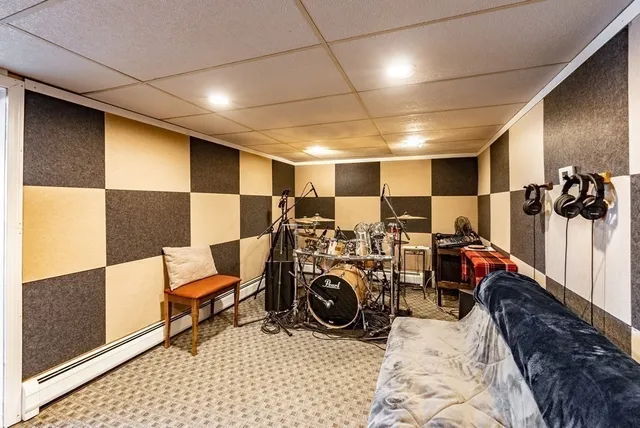 a living room with lots of furniture and a rug