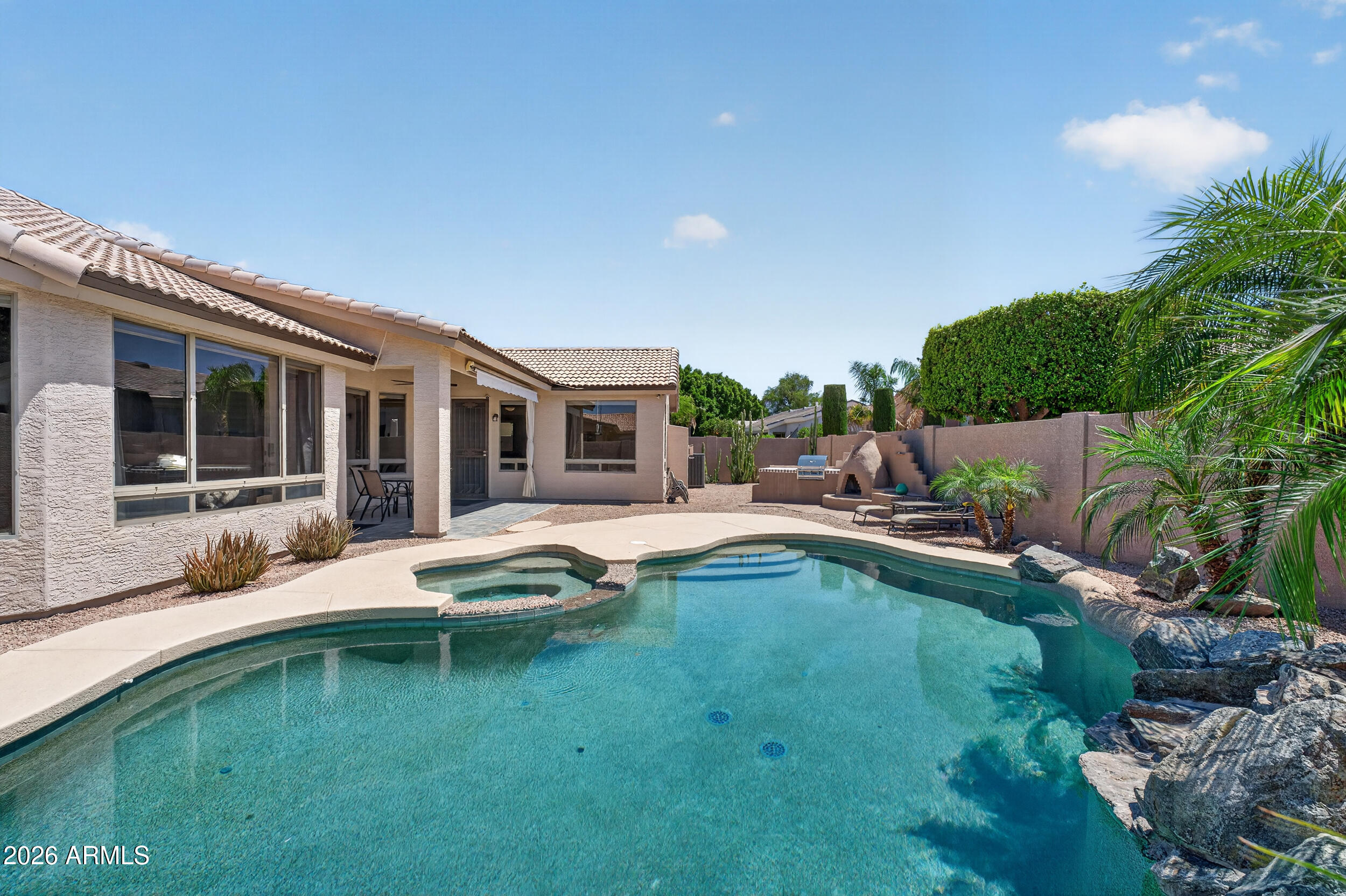 625 West Merrill Avenue Gilbert, AZ 85233 - Photo 1 of 48 a view of a house with swimming pool and porch