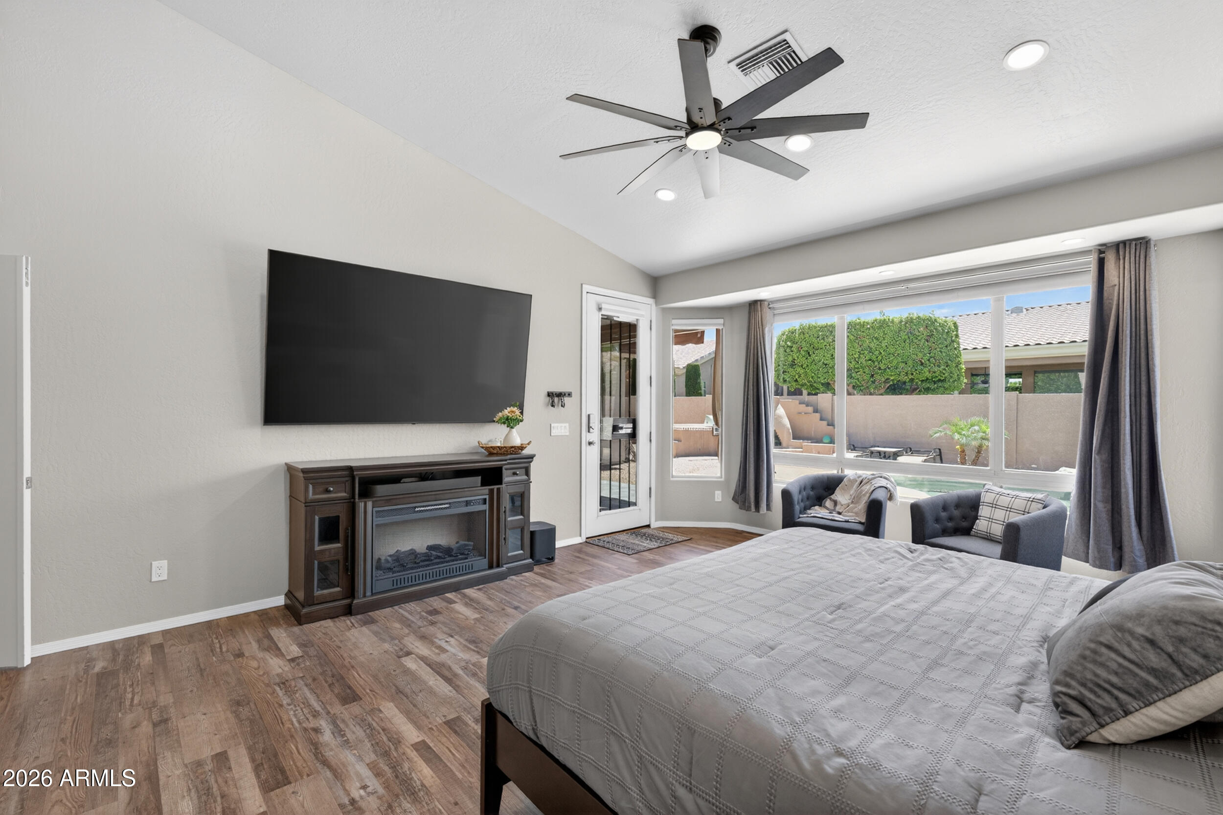 625 West Merrill Avenue Gilbert, AZ 85233 - Photo 17 of 48 a bedroom with a bed and a flat screen tv