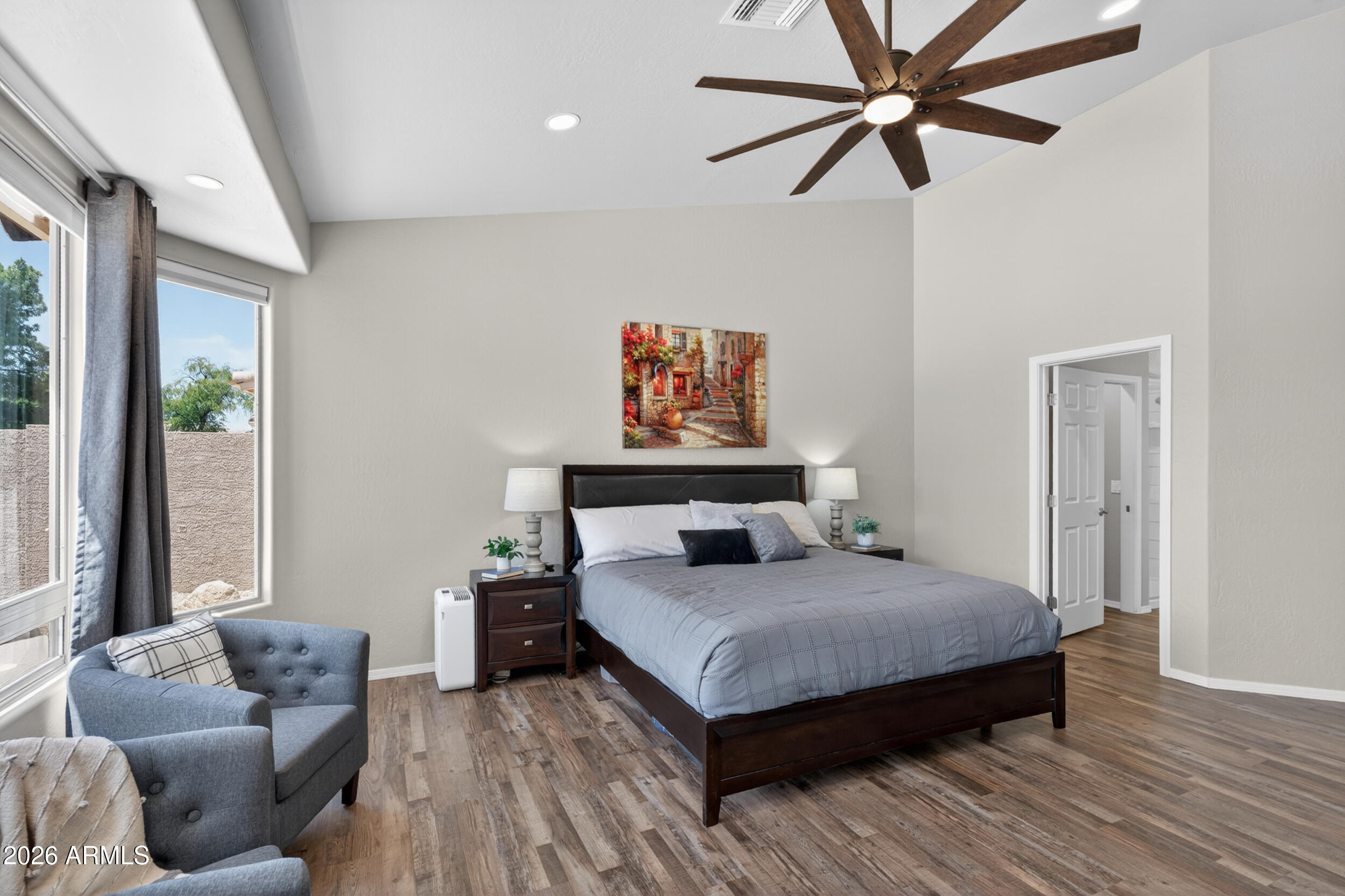 625 West Merrill Avenue Gilbert, AZ 85233 - Photo 18 of 48 a bedroom with a bed and wooden floor