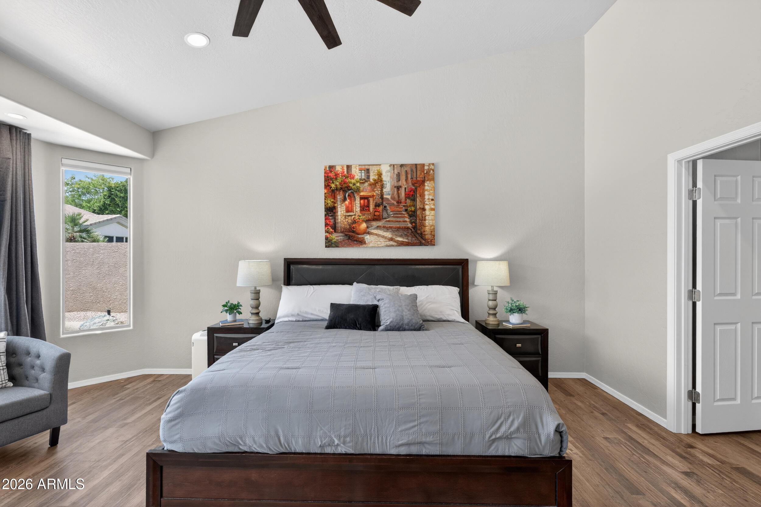625 West Merrill Avenue Gilbert, AZ 85233 - Photo 20 of 48 a bedroom with a bed and wooden floor