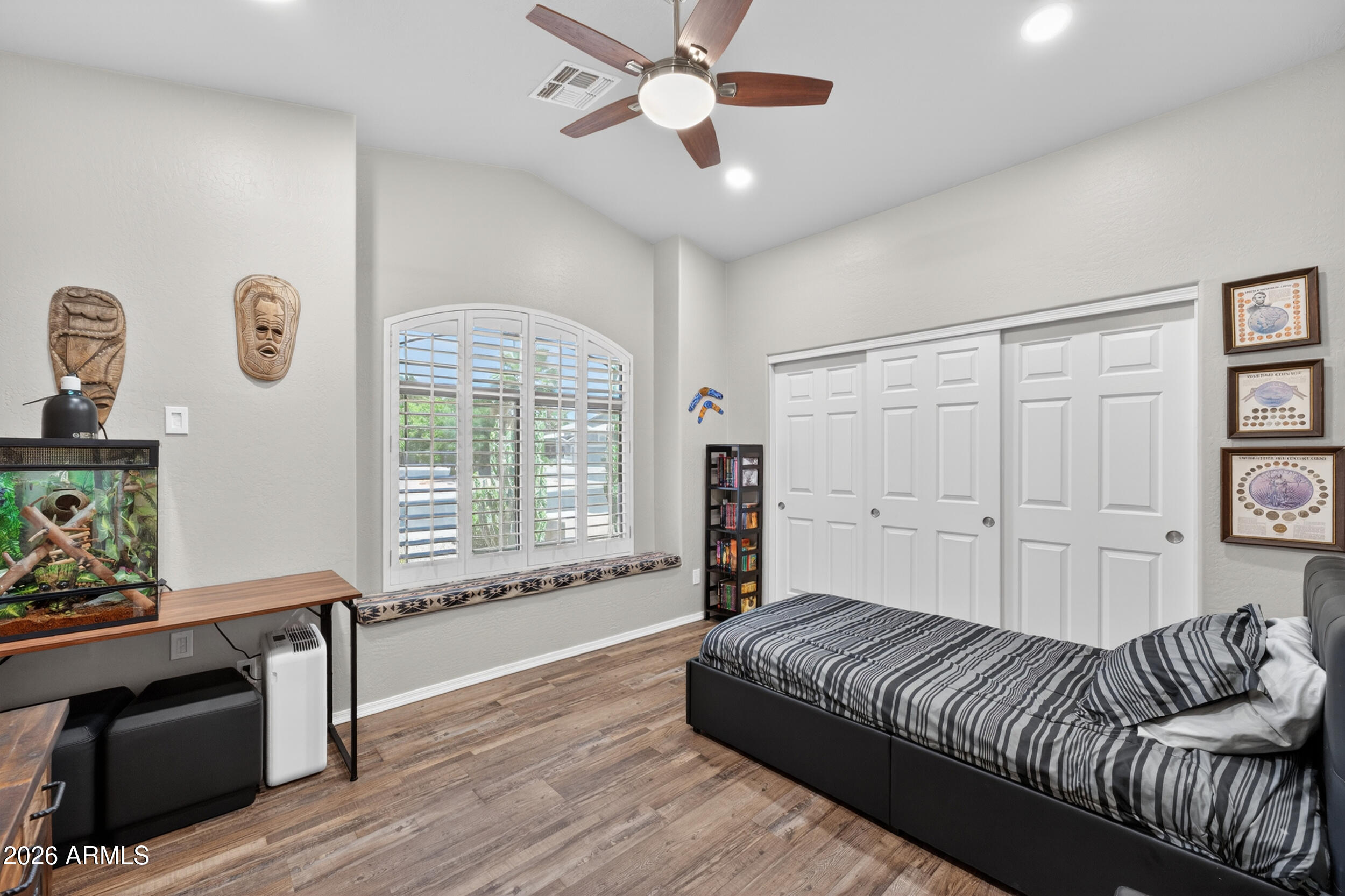 625 West Merrill Avenue Gilbert, AZ 85233 - Photo 24 of 48 a spacious bedroom with a bed and a window