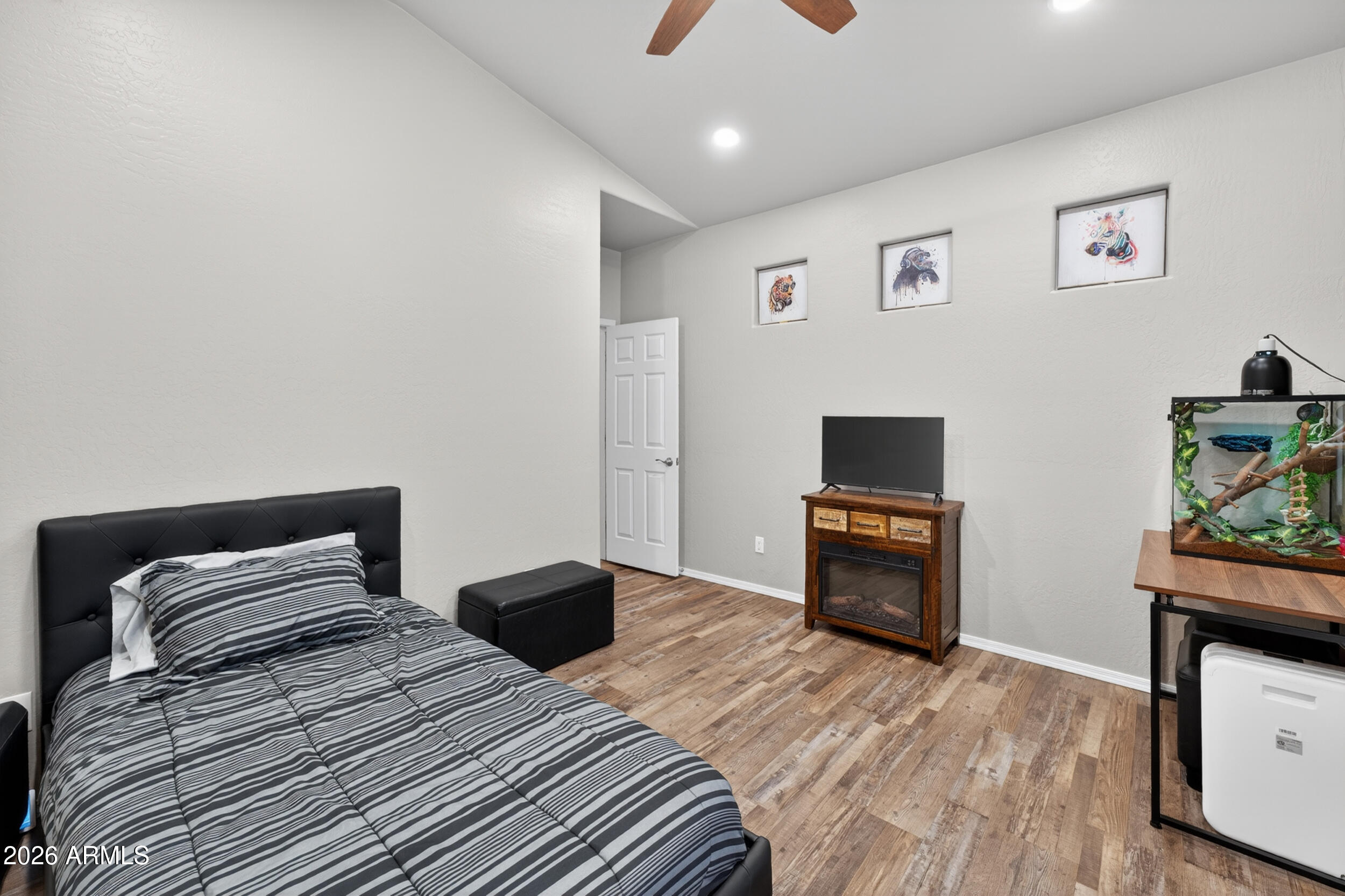 625 West Merrill Avenue Gilbert, AZ 85233 - Photo 25 of 48 a bedroom with a bed and a television