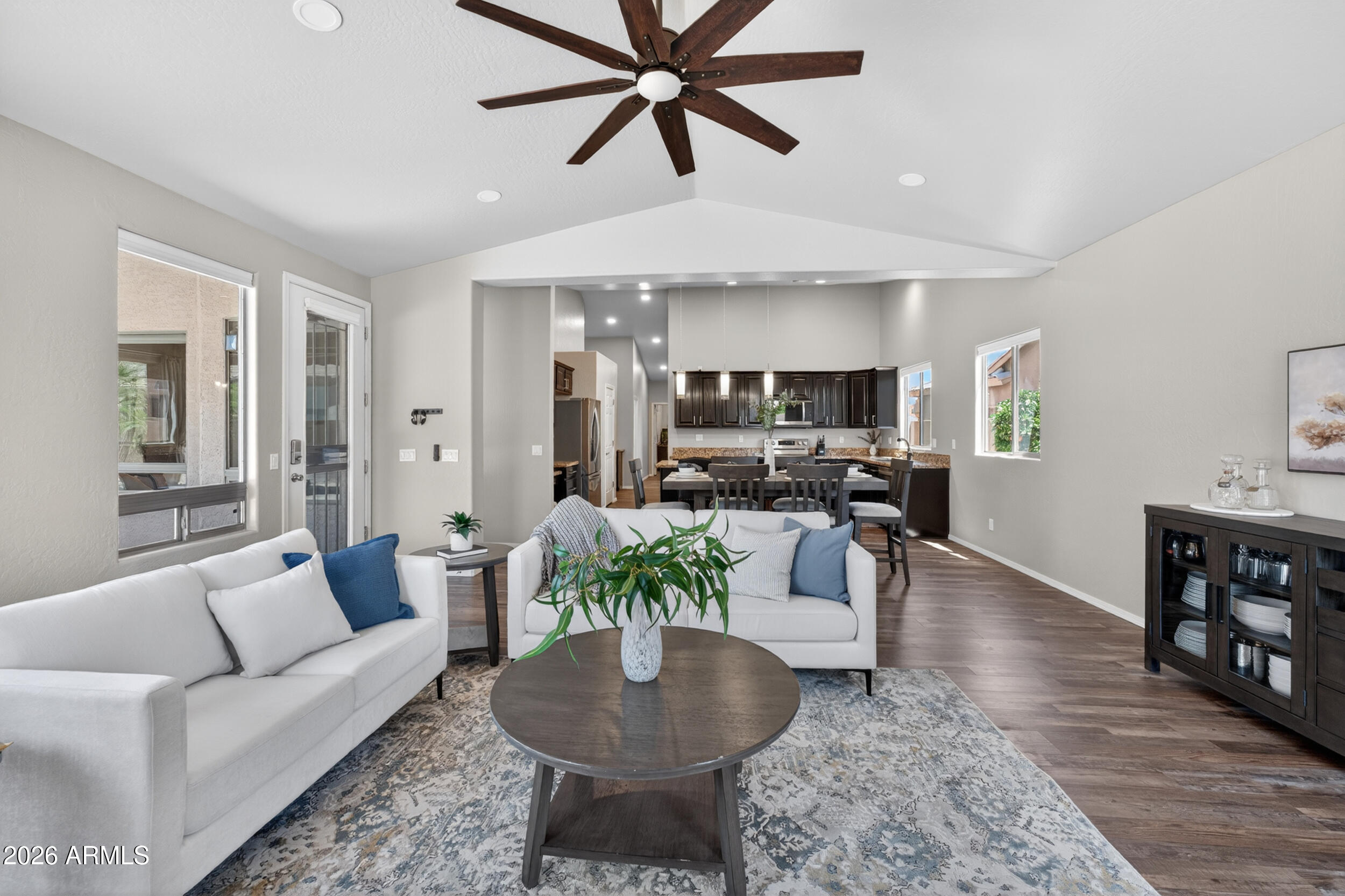625 West Merrill Avenue Gilbert, AZ 85233 - Photo 3 of 48 a living room with furniture a ceiling fan and a rug