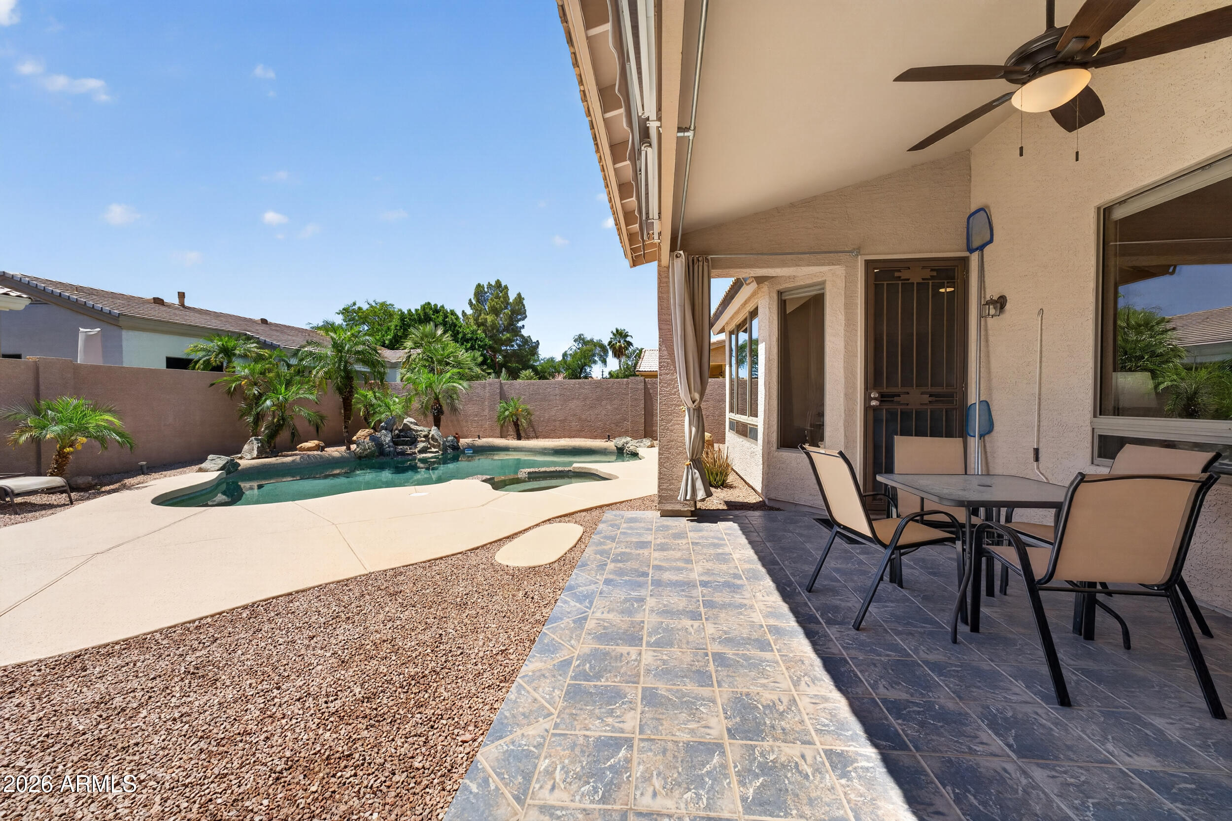 625 West Merrill Avenue Gilbert, AZ 85233 - Photo 35 of 48 a view of a patio with table and chairs and potted plants