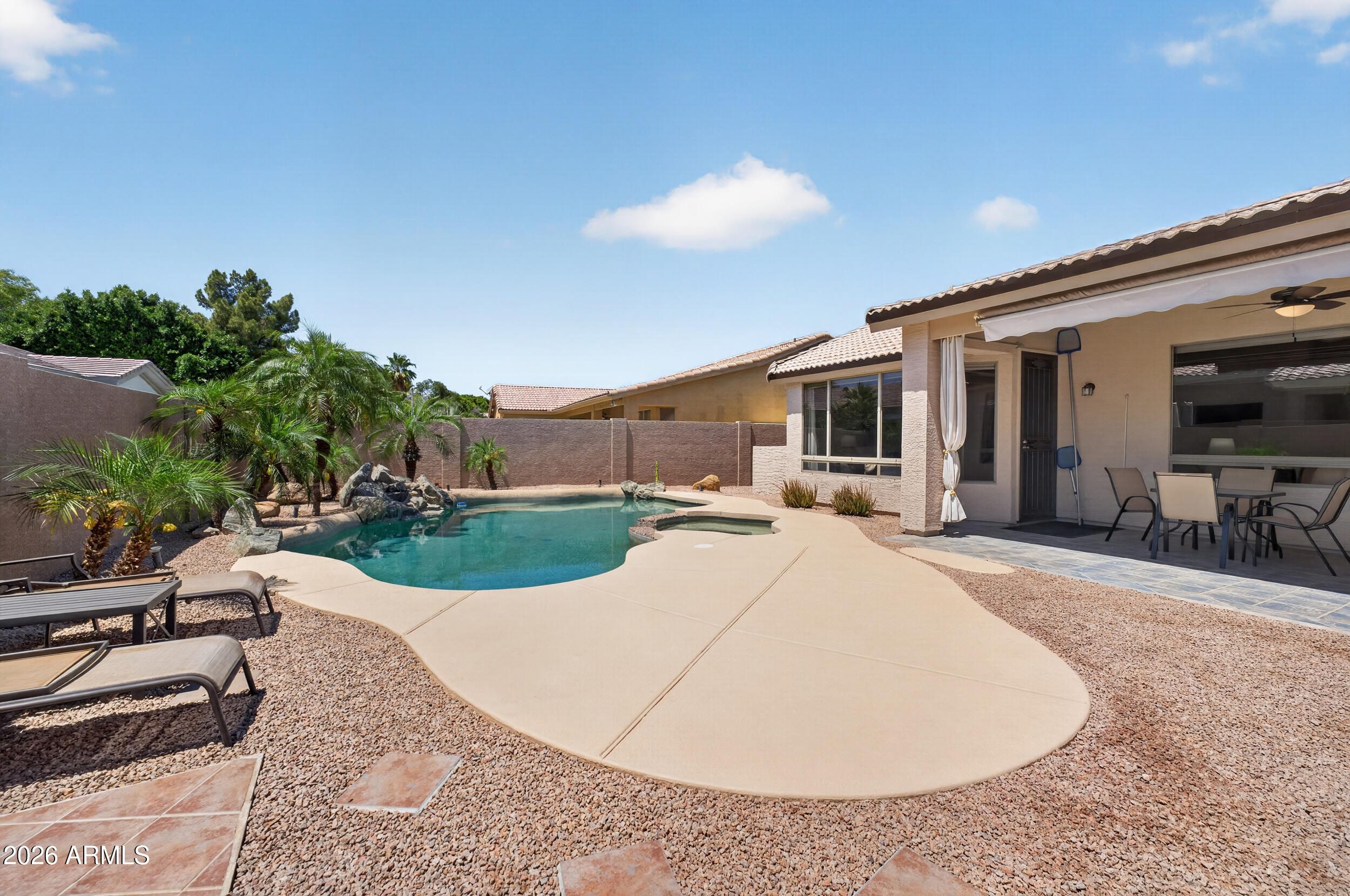625 West Merrill Avenue Gilbert, AZ 85233 - Photo 36 of 48 a view of a house with backyard and sitting area