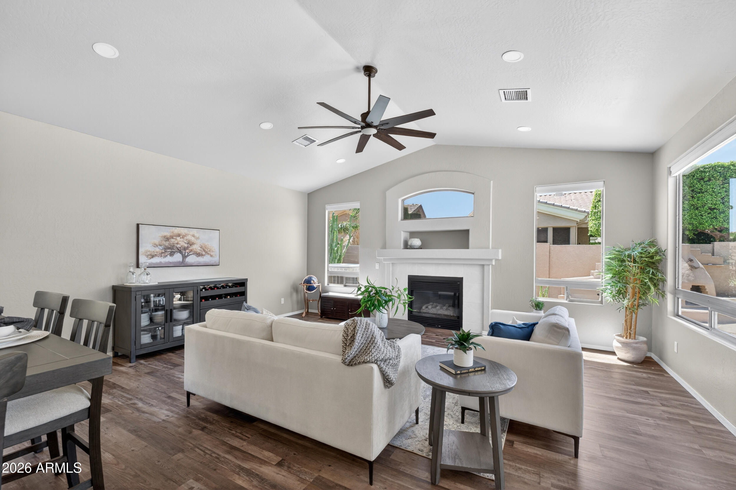625 West Merrill Avenue Gilbert, AZ 85233 - Photo 4 of 48 a living room with furniture a fireplace and wooden floor