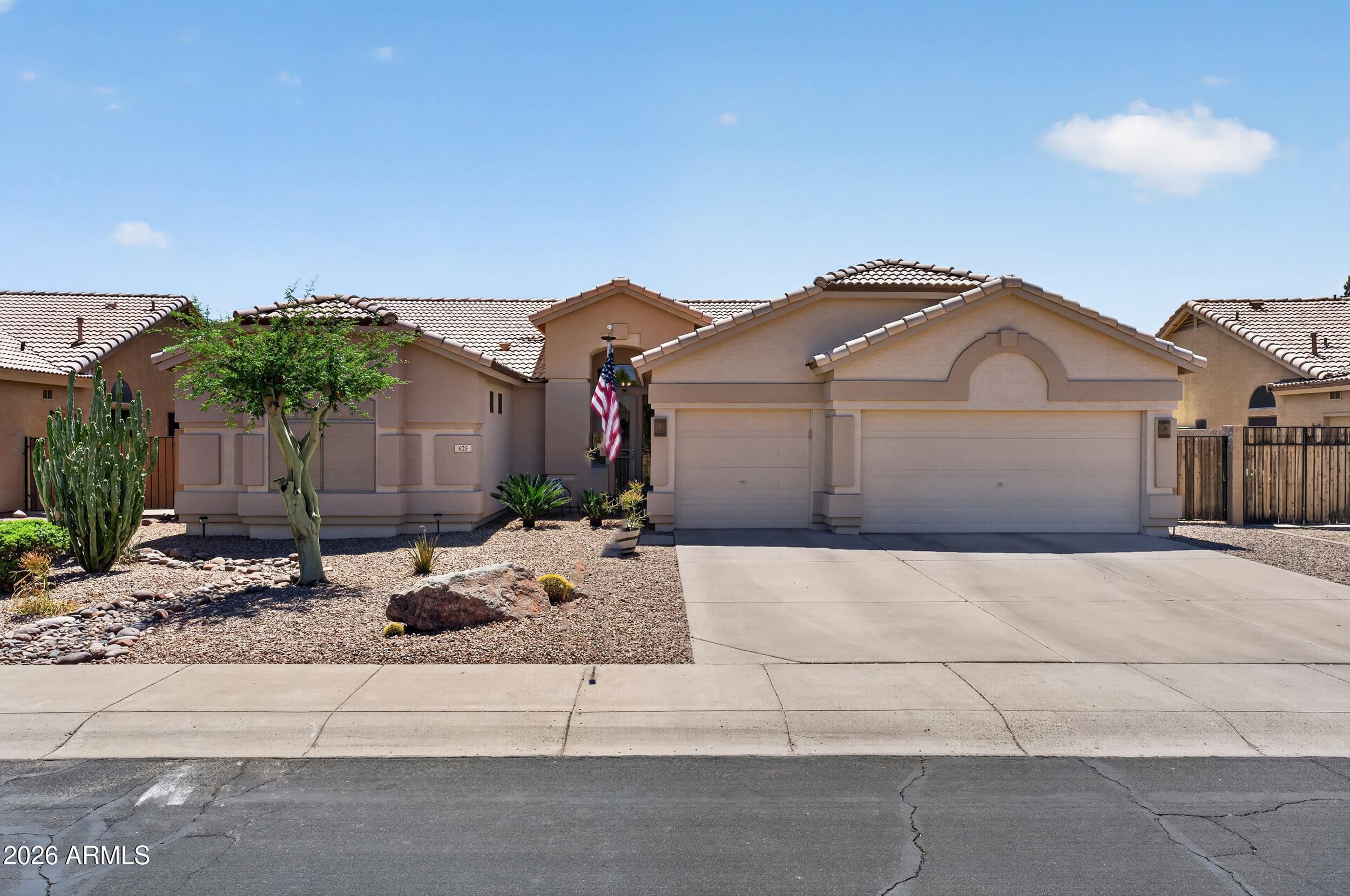 625 West Merrill Avenue Gilbert, AZ 85233 - Photo 42 of 48 a front view of a house with garden