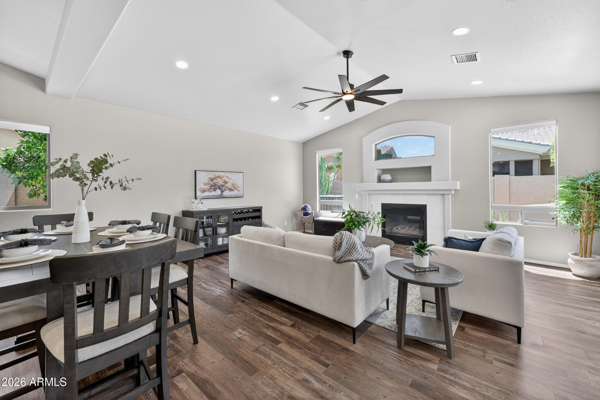 625 West Merrill Avenue Gilbert, AZ 85233 - Photo 6 of 48 a living room with furniture a fireplace and a table