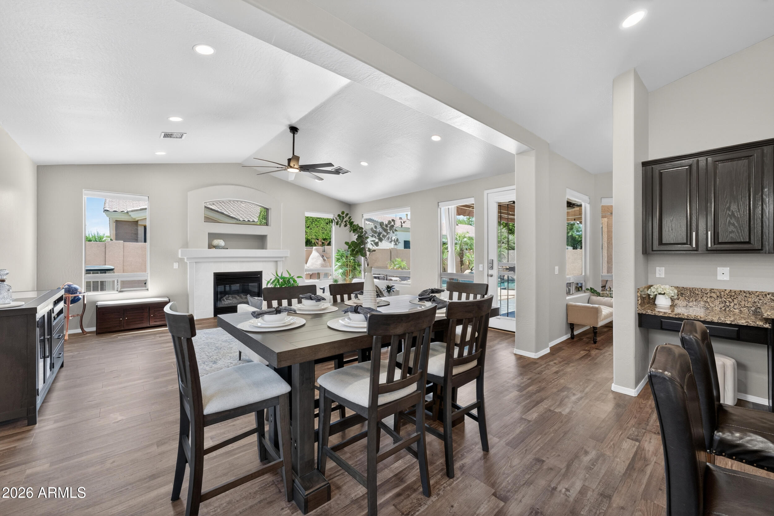 625 West Merrill Avenue Gilbert, AZ 85233 - Photo 7 of 48 a view of a dining room with furniture and a kitchen