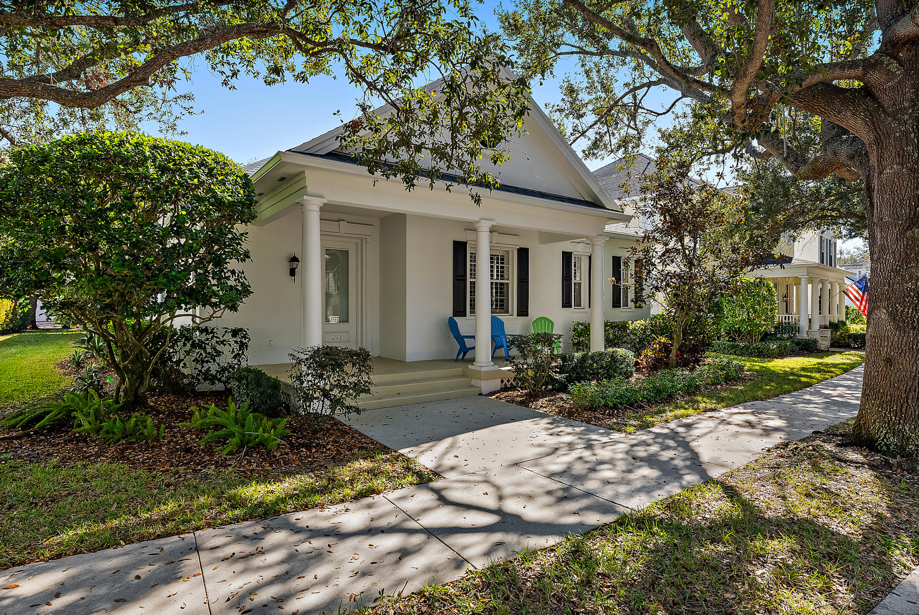 213 Barbados Drive Jupiter, FL 33458 - Photo 2 of 55 a view of a house with backyard and sitting area
