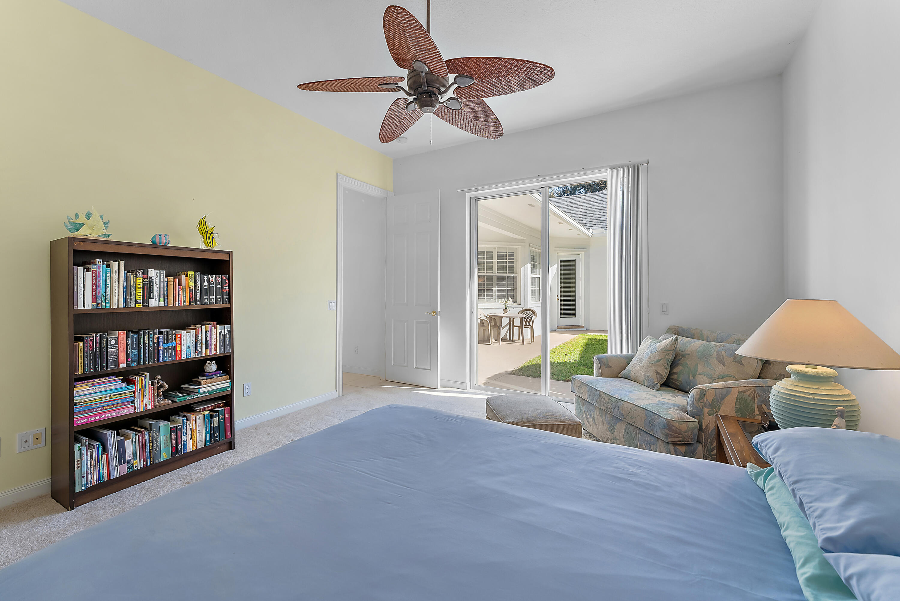 213 Barbados Drive Jupiter, FL 33458 - Photo 27 of 55 a living room with furniture and a book shelf