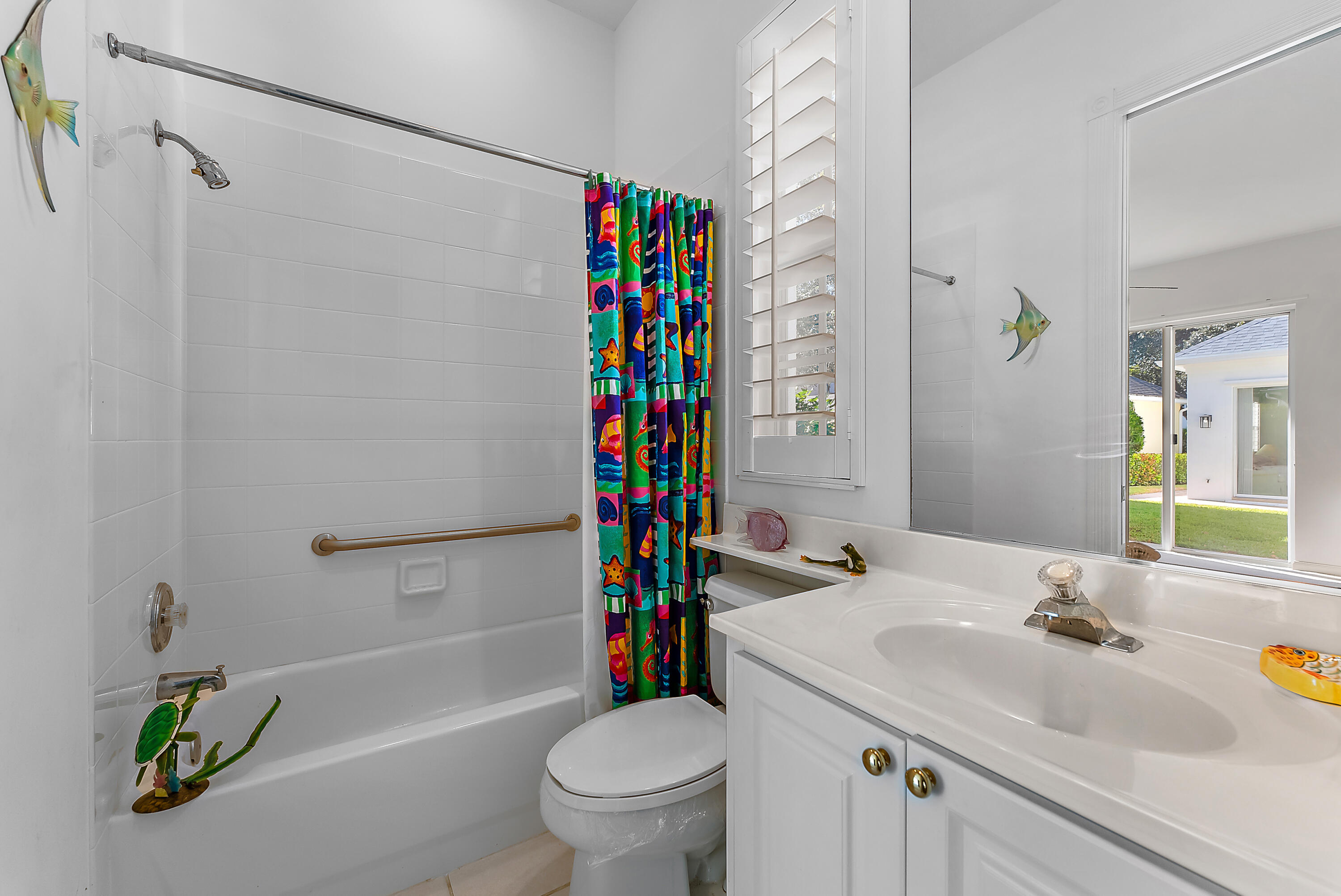 213 Barbados Drive Jupiter, FL 33458 - Photo 28 of 55 a bathroom with a sink toilet and shower