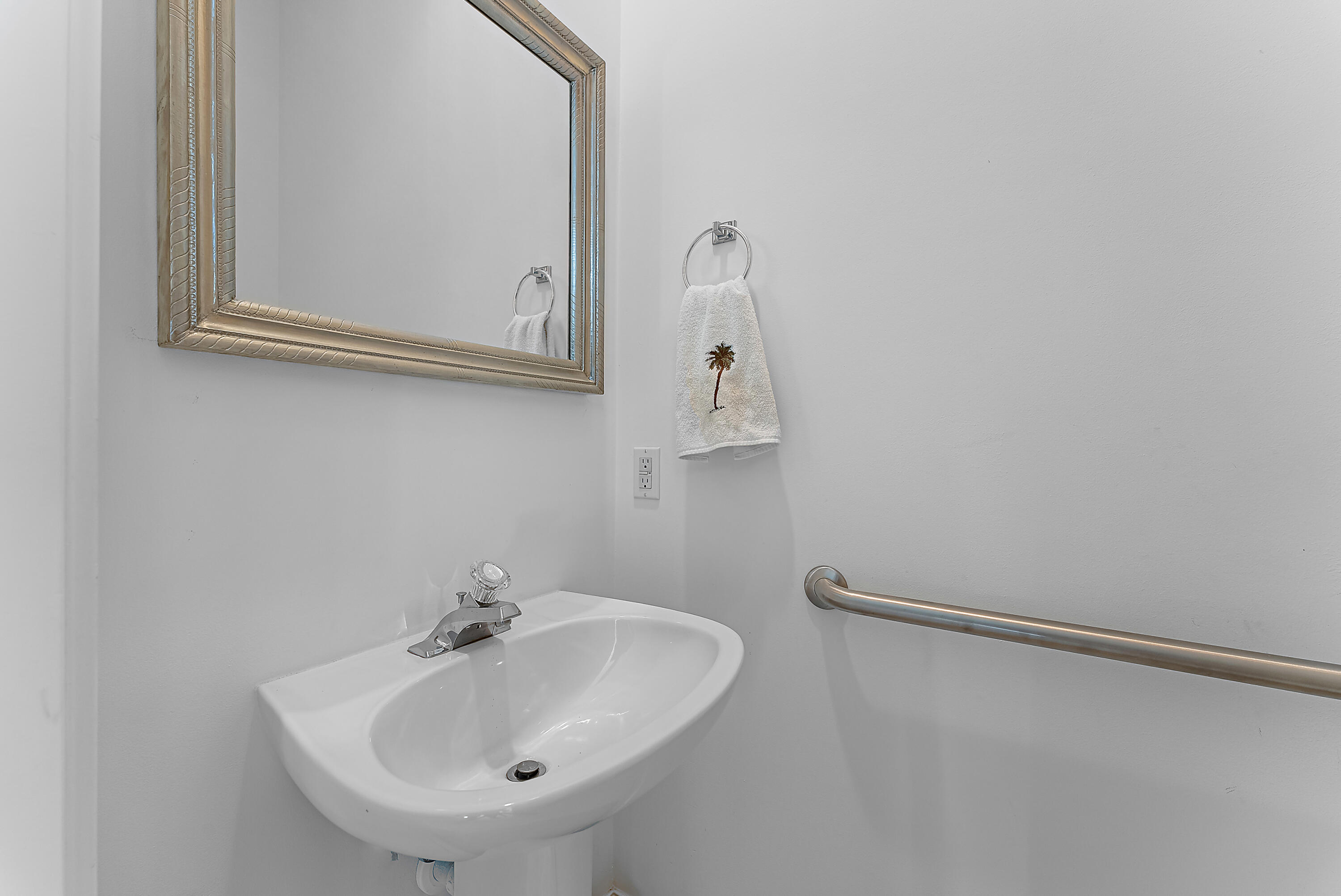 213 Barbados Drive Jupiter, FL 33458 - Photo 32 of 55 a bathroom with a sink and mirror