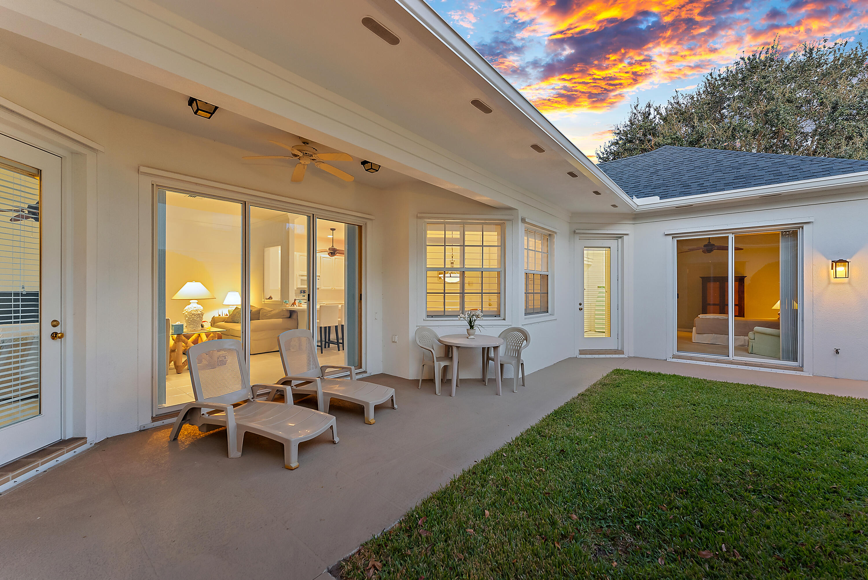 213 Barbados Drive Jupiter, FL 33458 - Photo 35 of 55 a building outdoor space with patio furniture and garden