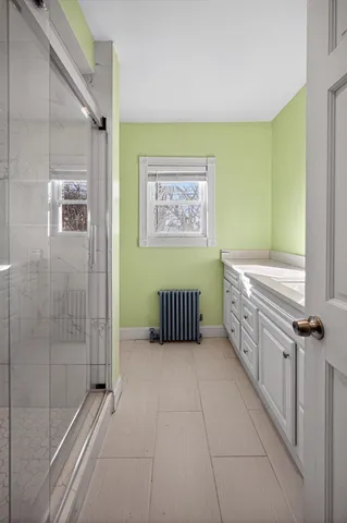 a bathroom with a sink a bathtub and a shower