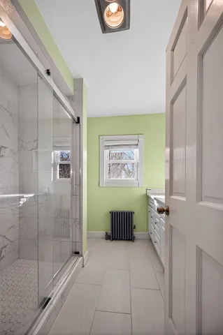 a bathroom with a bathtub and shower