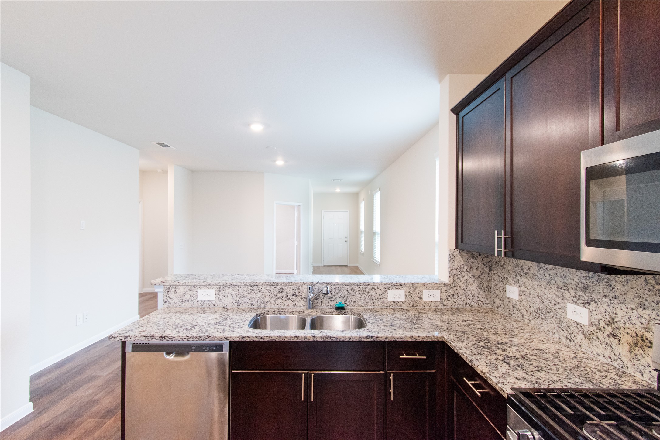 6938 Hobby Wind Ridge Drive Houston, TX 77075 - Photo 13 of 30 a bathroom with a granite countertop sink and a mirror