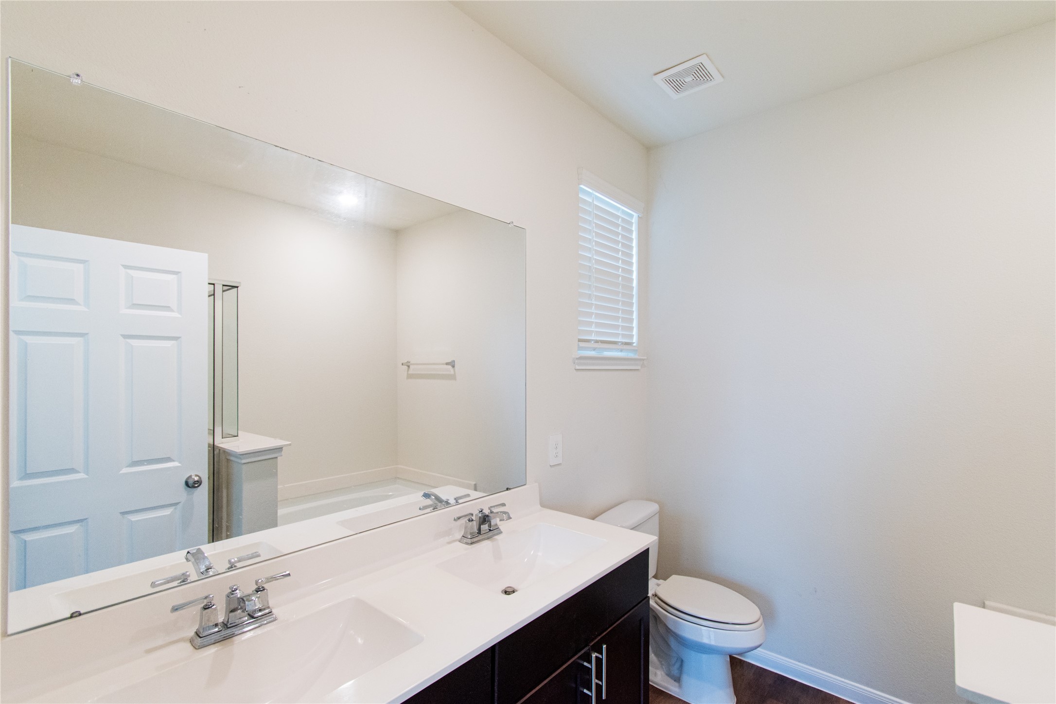 6938 Hobby Wind Ridge Drive Houston, TX 77075 - Photo 14 of 30 a bathroom with a sink toilet and vanity