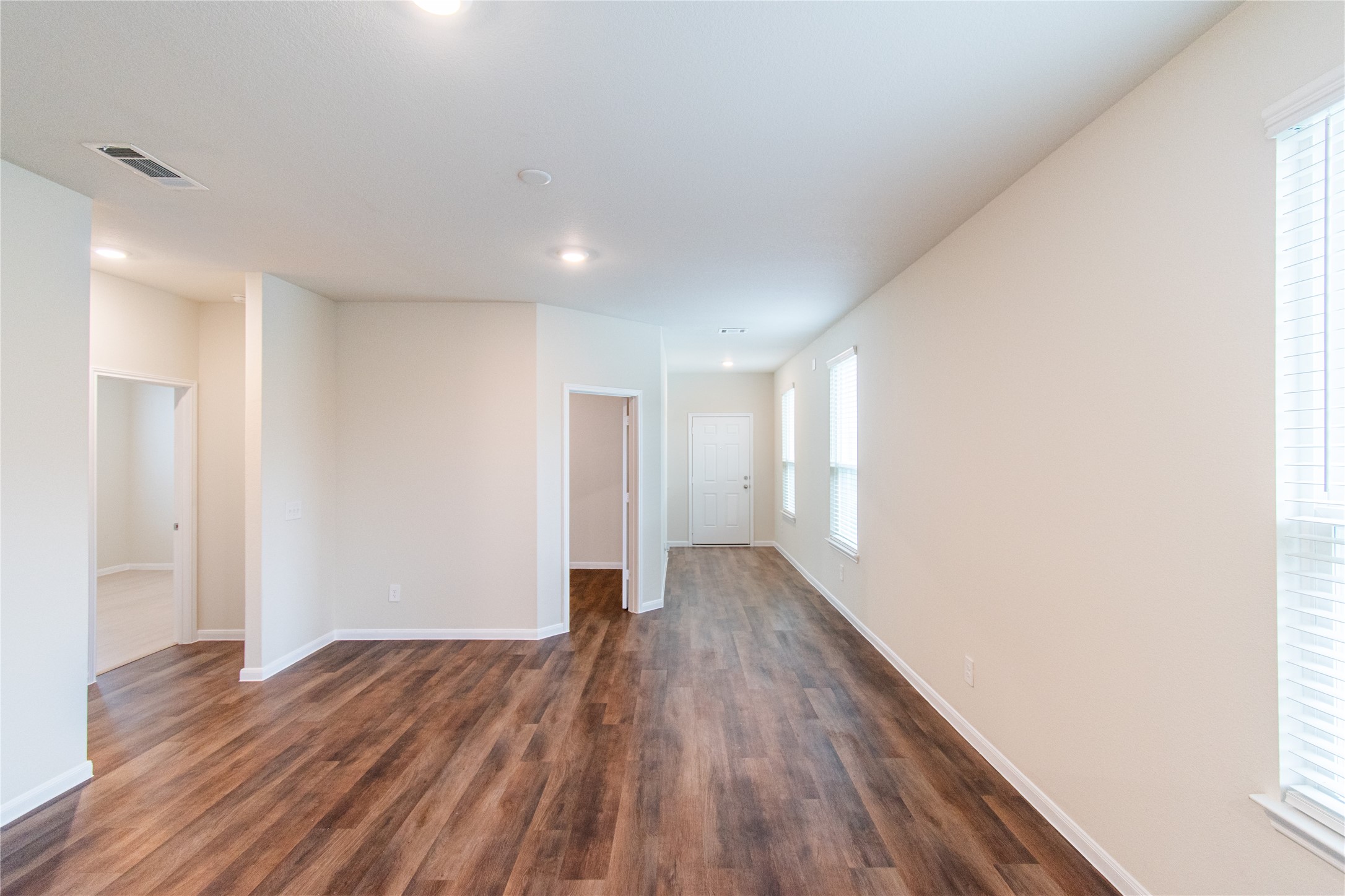 6938 Hobby Wind Ridge Drive Houston, TX 77075 - Photo 10 of 30 a view of empty room with wooden floor