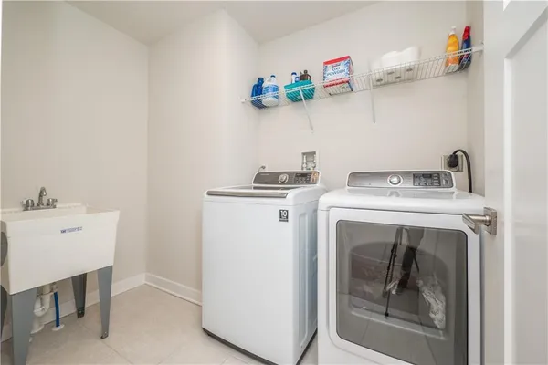 a utility room with dryer and washer