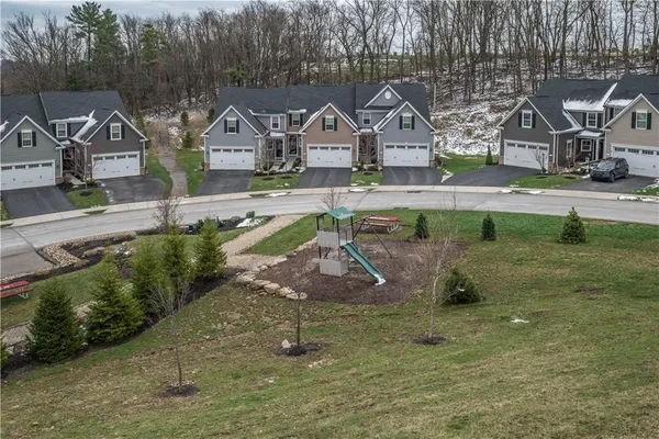 a aerial view of a house with a yard