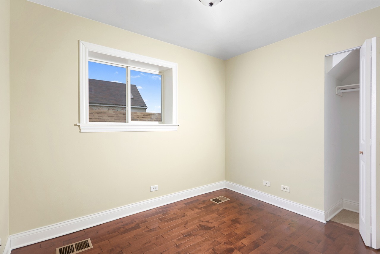 2649 West 21st Place Chicago, IL 60608 - Photo 12 of 26 an empty room with a window