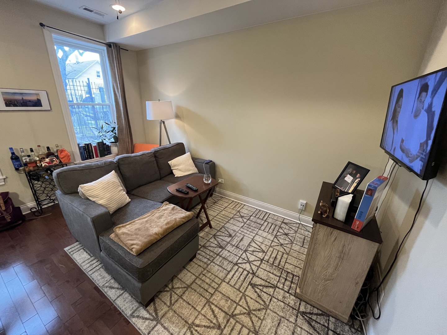2649 West 21st Place Chicago, IL 60608 - Photo 16 of 26 a living room with furniture rug and wooden floor