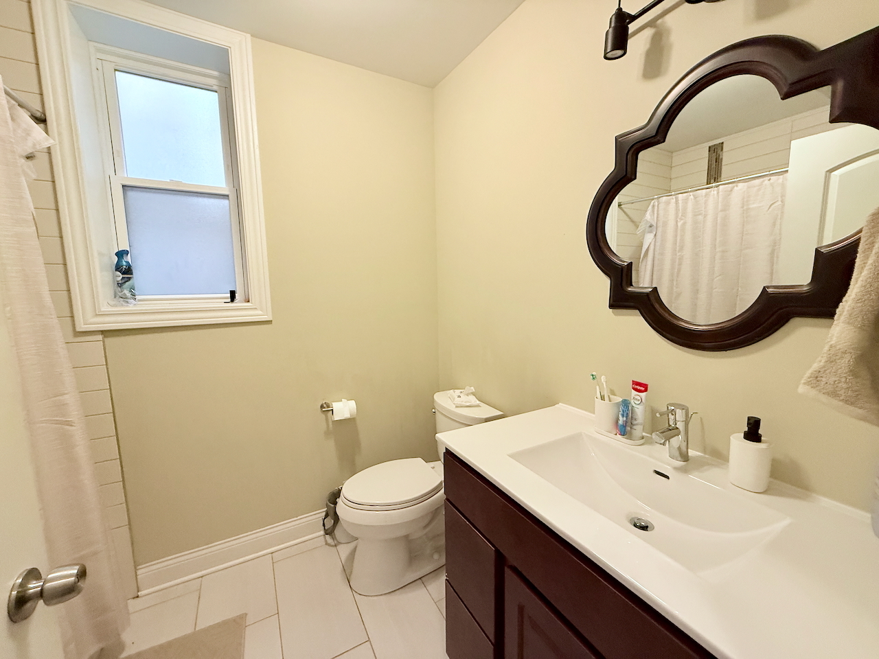 2649 West 21st Place Chicago, IL 60608 - Photo 19 of 26 a bathroom with a sink and a mirror