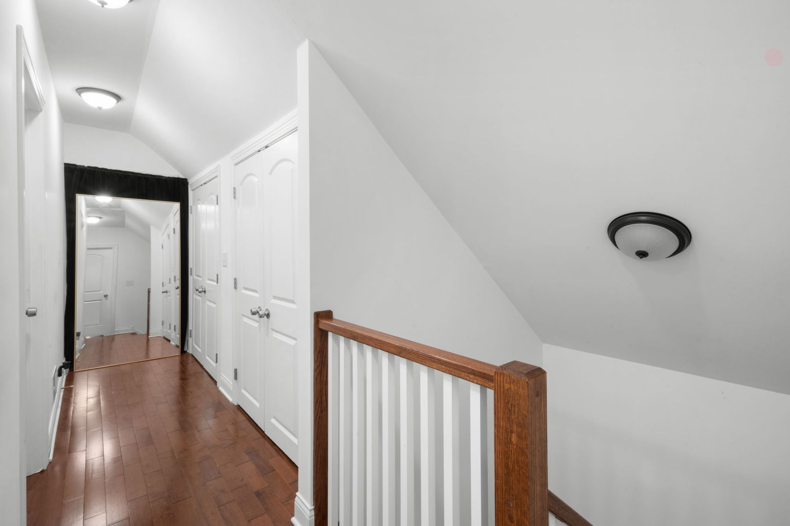 2649 West 21st Place Chicago, IL 60608 - Photo 8 of 26 a view of a hallway with wooden floor