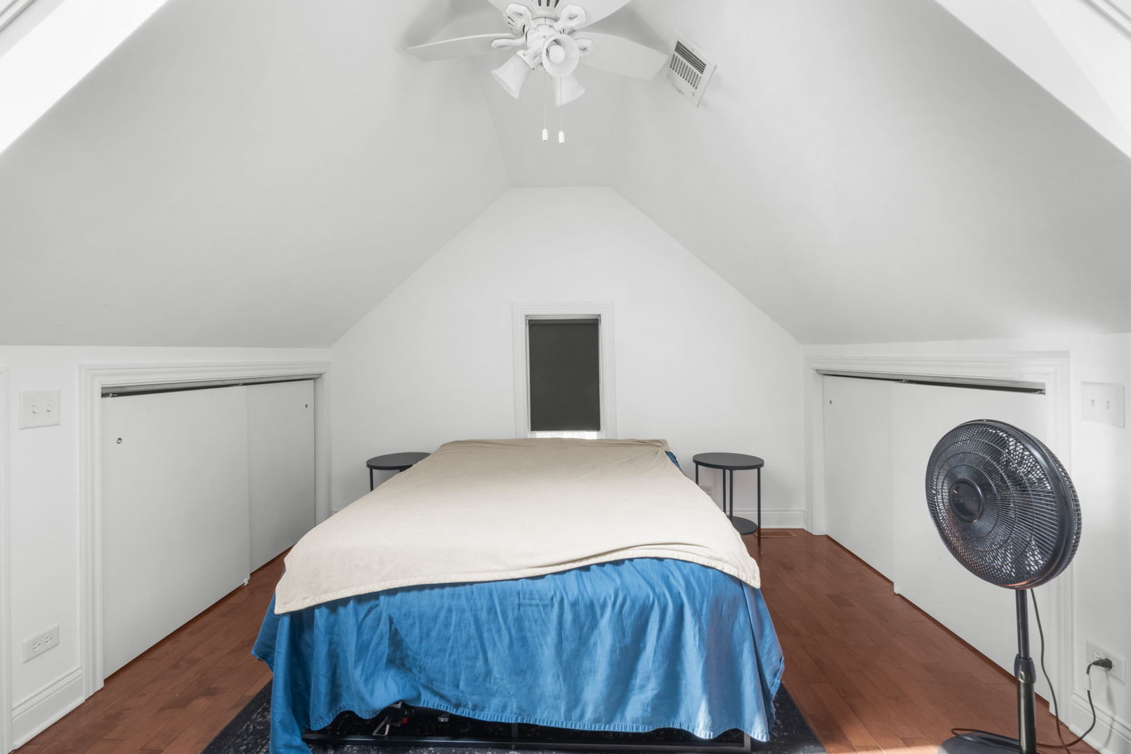 2649 West 21st Place Chicago, IL 60608 - Photo 10 of 26 a bedroom with a bed and a chandelier