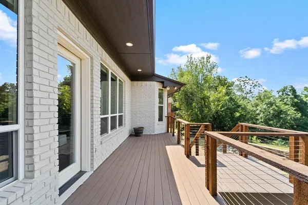a view of a balcony with chairs