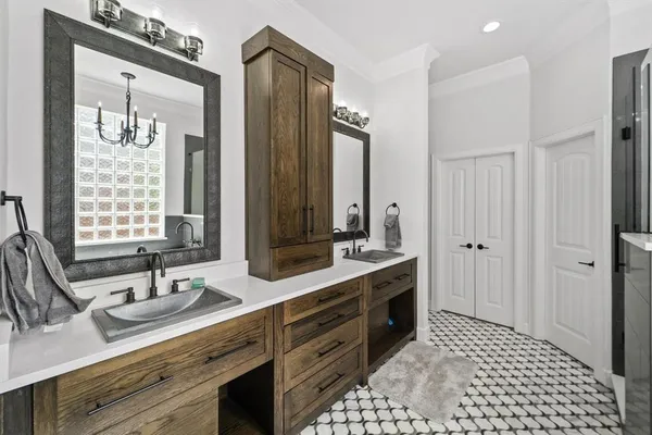 a bathroom with a double vanity sink mirror and double