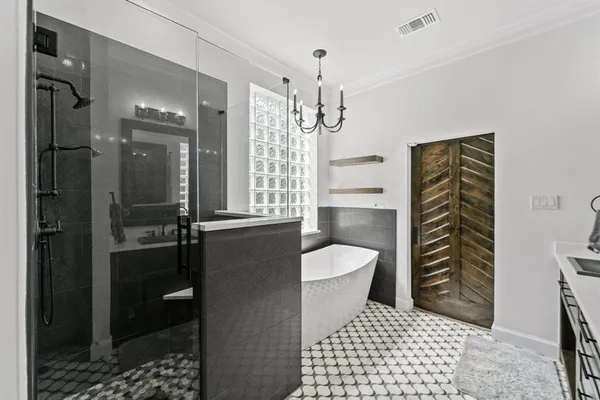 a bathroom with a toilet a sink and shower
