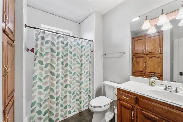 a bathroom with a sink toilet and shower