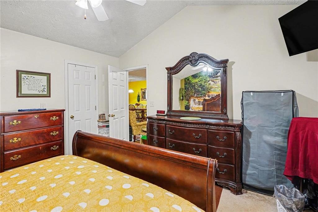 204 Hailey Lane Griffin, GA 30223 - Photo 16 of 32 a living room with furniture and a flat screen tv