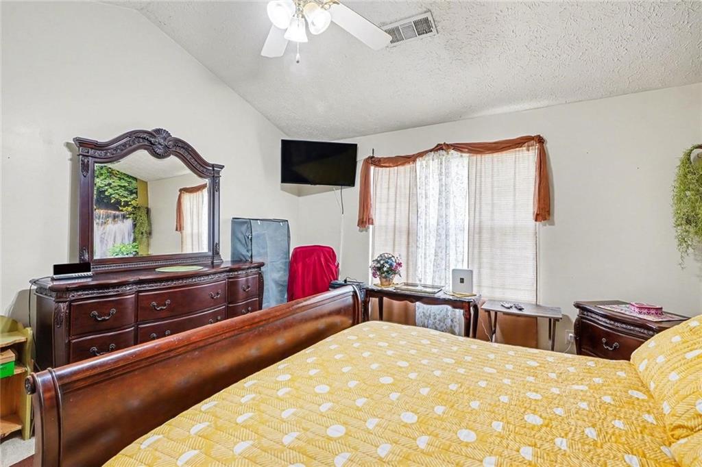 204 Hailey Lane Griffin, GA 30223 - Photo 17 of 32 a bed room with a bed and a television