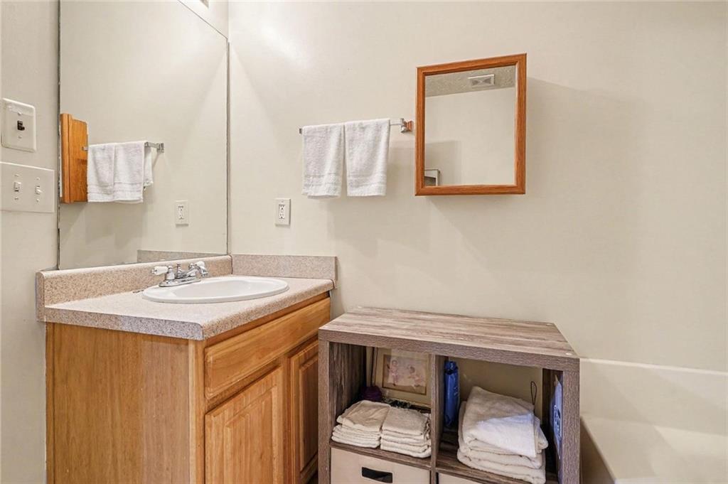 204 Hailey Lane Griffin, GA 30223 - Photo 19 of 32 a bathroom with a sink a toilet and mirror