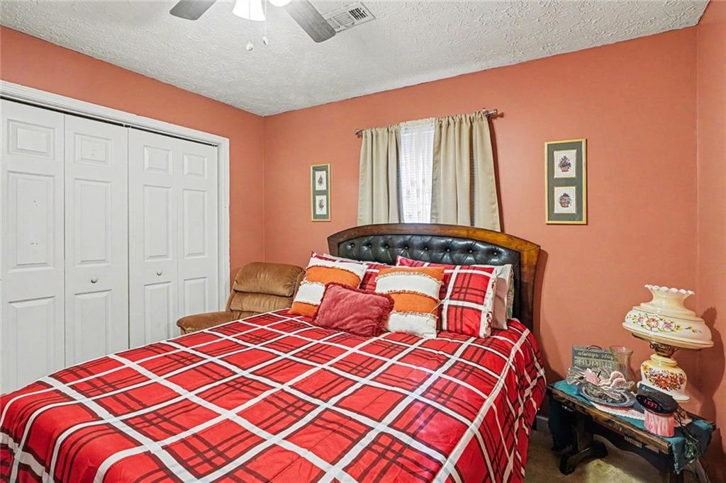 204 Hailey Lane Griffin, GA 30223 - Photo 23 of 32 a bedroom with a bed and a window