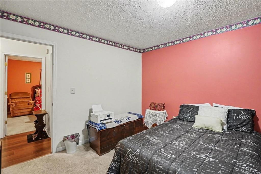 204 Hailey Lane Griffin, GA 30223 - Photo 26 of 32 a bedroom with a bed and a window